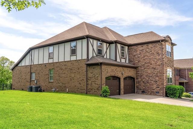 230 Fowler Cir, Franklin, TN 37064 - view of side of property with an attached garage, a yard, board and batten siding, and driveway