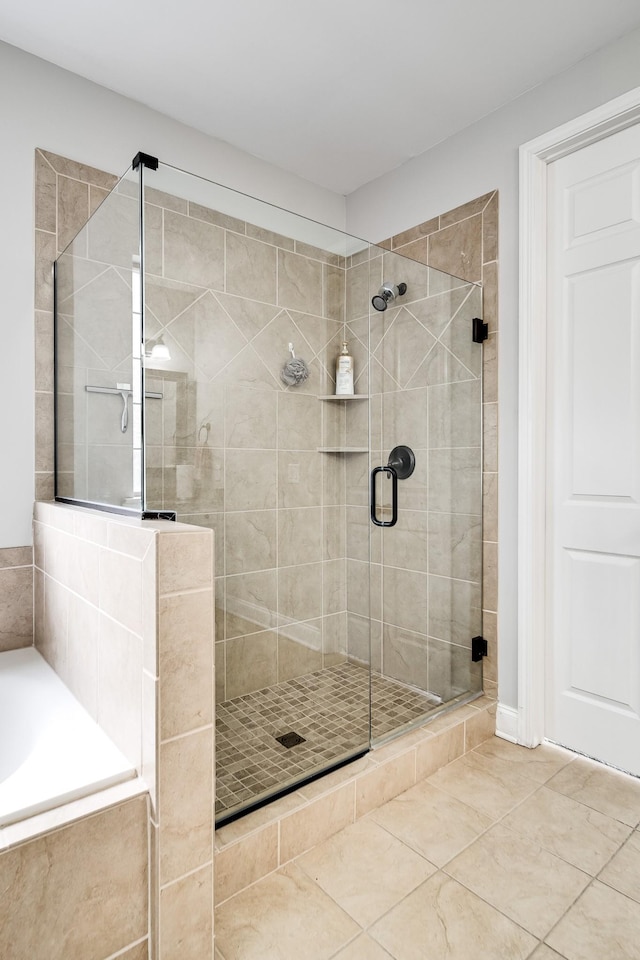230 Fowler Cir, Franklin, TN 37064 - bathroom featuring a shower stall, tile patterned floors, and a bath