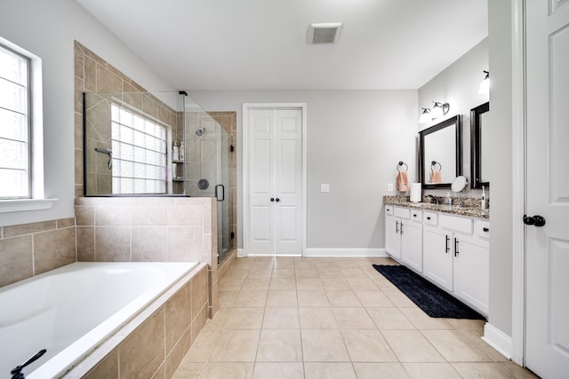 230 Fowler Cir, Franklin, TN 37064 - bathroom with vanity, a garden tub, a stall shower, and tile patterned floors