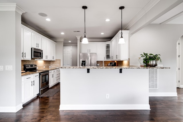 230 Fowler Cir, Franklin, TN 37064 - kitchen with appliances with stainless steel finishes, a kitchen breakfast bar, glass insert cabinets, crown molding, and light stone counters