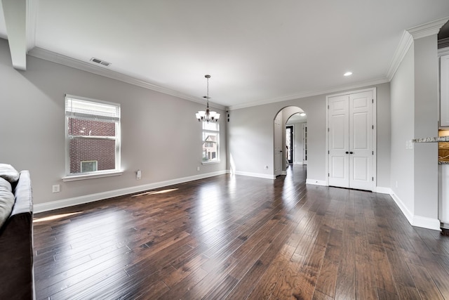 230 Fowler Cir, Franklin, TN 37064 - unfurnished living room featuring arched walkways, a chandelier, dark wood-style flooring, recessed lighting, and crown molding