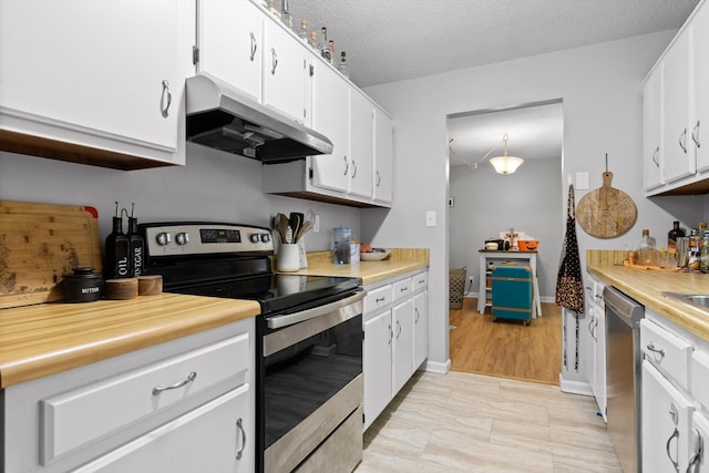 3222 Joselin Ln, Chattanooga, TN 37415 - kitchen featuring appliances with stainless steel finishes, under cabinet range hood, light countertops, white cabinets, and a textured ceiling