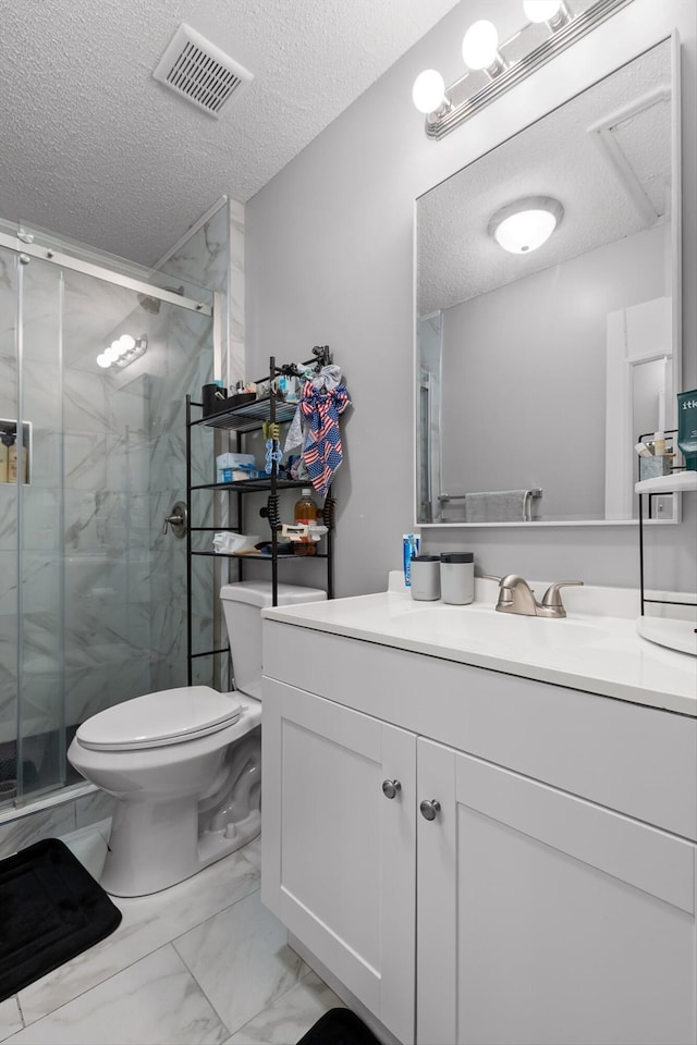 3222 Joselin Ln, Chattanooga, TN 37415 - bathroom featuring a textured ceiling, marble look tiles, vanity, and a marble finish shower