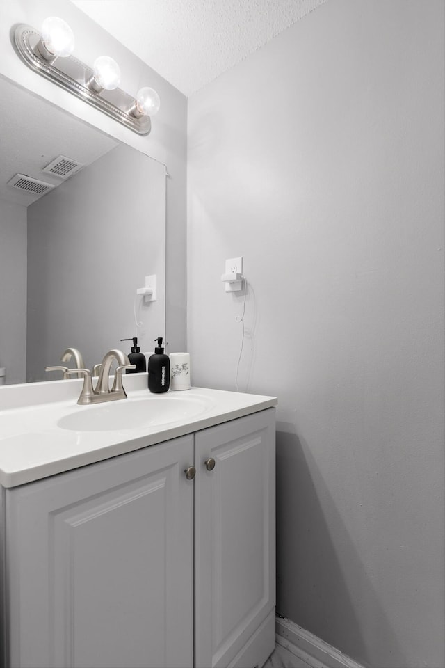 3222 Joselin Ln, Chattanooga, TN 37415 - bathroom with vanity, a textured ceiling, and marble finish floors