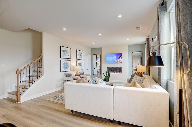 286 Subban Ct, Lebanon, TN 37087 - living room featuring light wood-style flooring, stairs, and recessed lighting