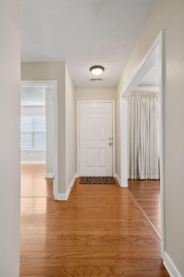 7023 Timber Oak Dr, Mount Juliet, TN 37122 - entryway featuring a textured ceiling and wood finished floors