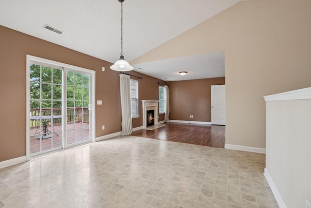 7023 Timber Oak Dr, Mount Juliet, TN 37122 - unfurnished living room with lofted ceiling and a fireplace with flush hearth