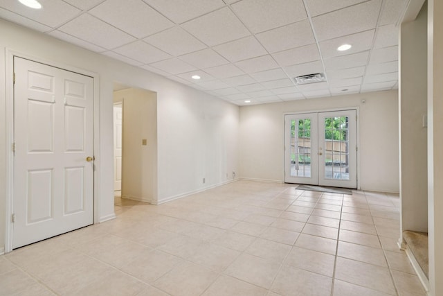 7023 Timber Oak Dr, Mount Juliet, TN 37122 - unfurnished room featuring a drop ceiling, light tile patterned floors, french doors, and recessed lighting