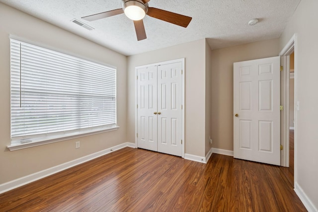 7023 Timber Oak Dr, Mount Juliet, TN 37122 - unfurnished bedroom featuring wood finished floors, a textured ceiling, a closet, and ceiling fan