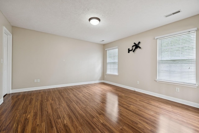 7023 Timber Oak Dr, Mount Juliet, TN 37122 - spare room with dark wood-style floors, healthy amount of natural light, and a textured ceiling