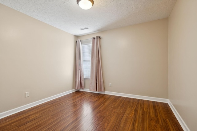 7023 Timber Oak Dr, Mount Juliet, TN 37122 - empty room featuring a textured ceiling and dark wood-type flooring