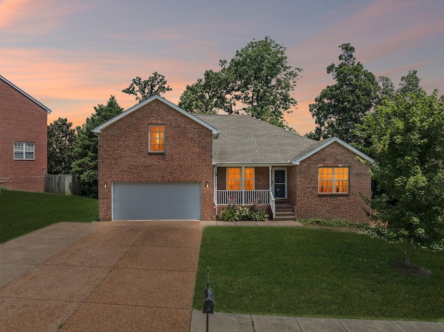7023 Timber Oak Dr, Mount Juliet, TN 37122 - view of front of house featuring brick siding, driveway, covered porch, and a yard