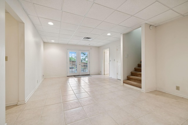 7023 Timber Oak Dr, Mount Juliet, TN 37122 - unfurnished room featuring a paneled ceiling, light tile patterned floors, stairs, recessed lighting, and french doors