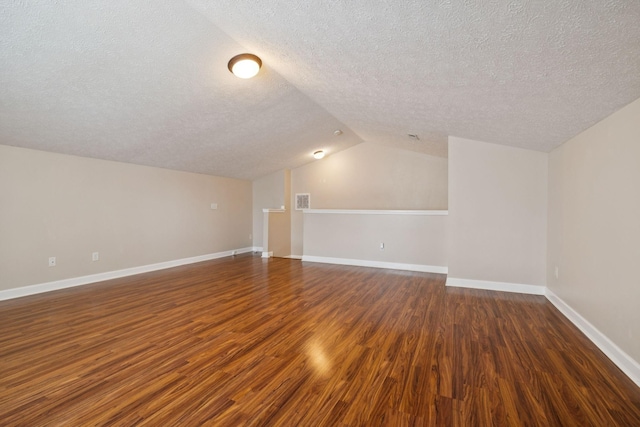 7023 Timber Oak Dr, Mount Juliet, TN 37122 - bonus room featuring a textured ceiling, wood finished floors, and vaulted ceiling