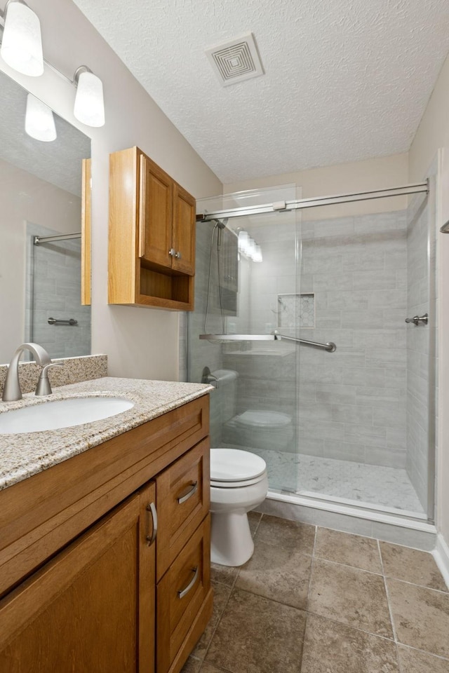 7023 Timber Oak Dr, Mount Juliet, TN 37122 - bathroom with vanity, a shower stall, and a textured ceiling