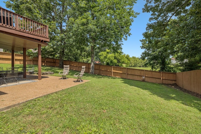 7023 Timber Oak Dr, Mount Juliet, TN 37122 - fenced backyard featuring a patio area, an outdoor fire pit, and a deck