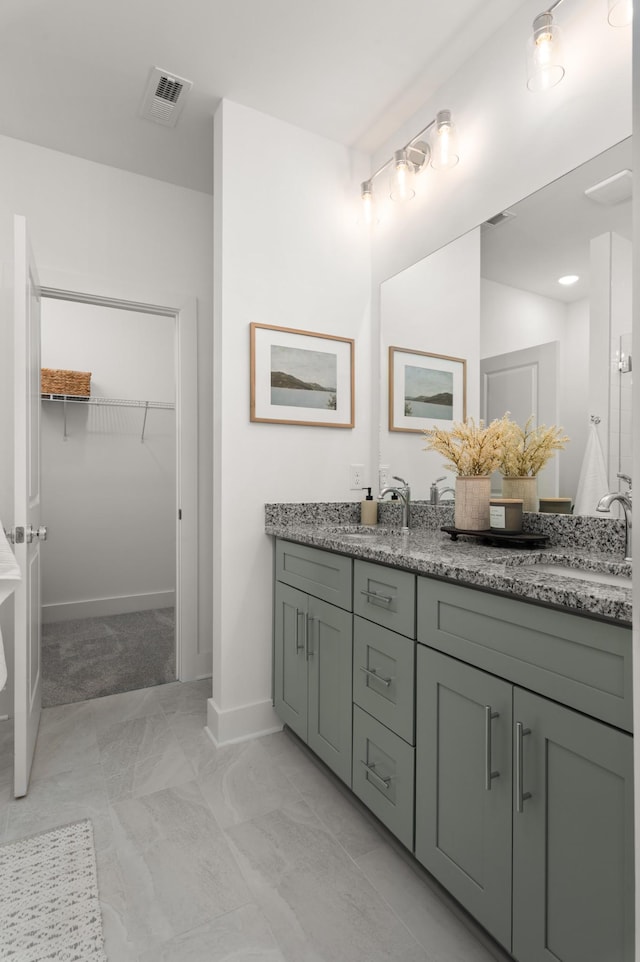 307 Panther Dr, Murfreesboro, TN 37127 - full bathroom with double vanity, marble look tiles, and a walk in closet