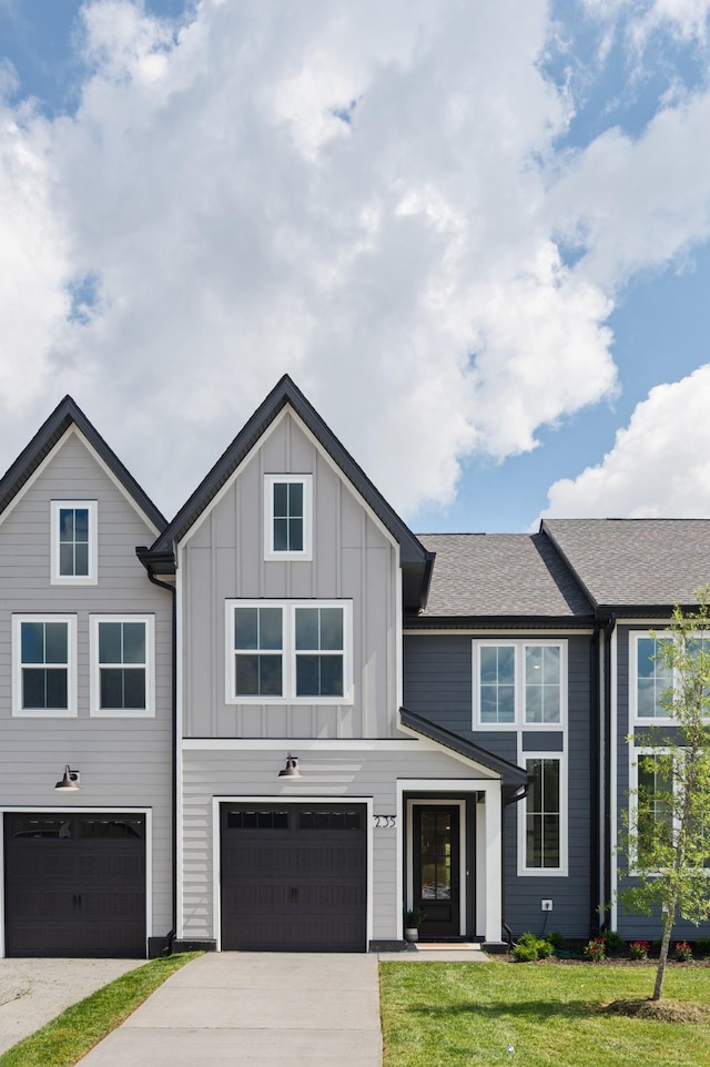 307 Panther Dr, Murfreesboro, TN 37127 - modern farmhouse featuring driveway, a garage, board and batten siding, a front yard, and roof with shingles