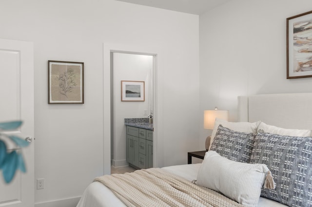 307 Panther Dr, Murfreesboro, TN 37127 - bedroom with connected bathroom and baseboards