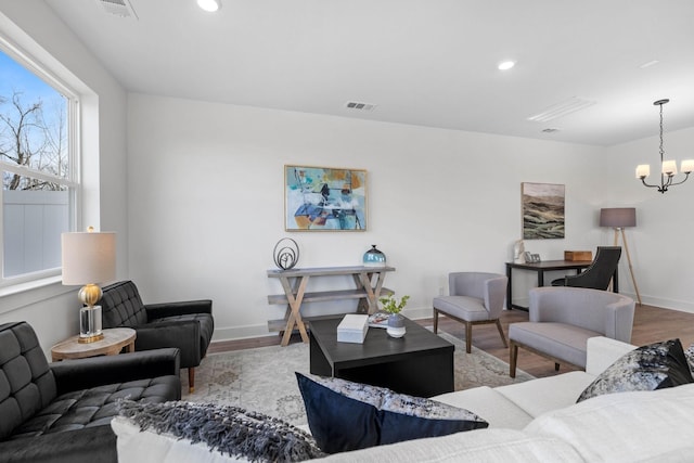 6051 Mill Tree Ct, Nashville, TN 37221 - living room with wood finished floors, a chandelier, and recessed lighting