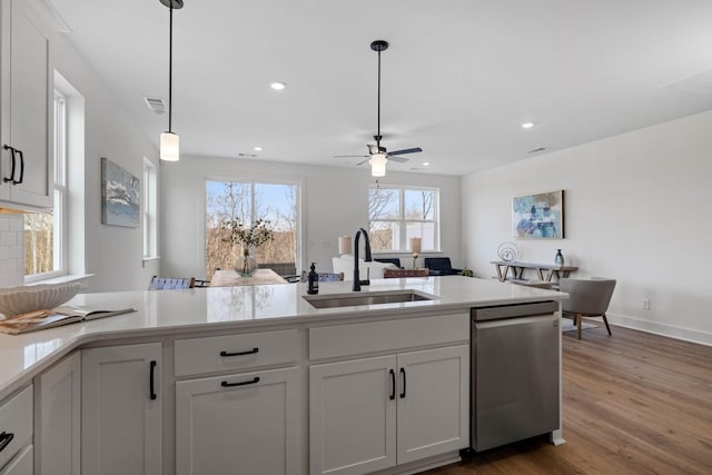 6051 Mill Tree Ct, Nashville, TN 37221 - kitchen featuring stainless steel dishwasher, a ceiling fan, light countertops, white cabinets, and dark wood-style flooring