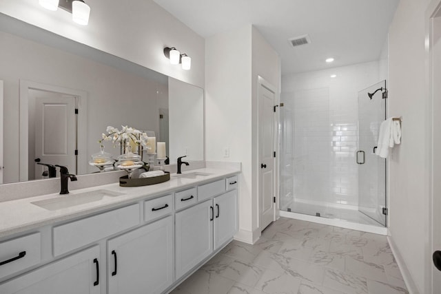 6051 Mill Tree Ct, Nashville, TN 37221 - full bathroom with marble look tile flooring, double vanity, a shower stall, and recessed lighting