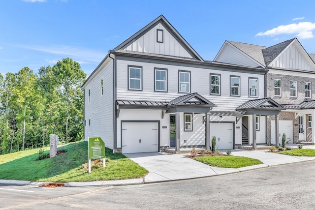 6051 Mill Tree Ct, Nashville, TN 37221 - modern inspired farmhouse with board and batten siding, a standing seam roof, an attached garage, concrete driveway, and a front lawn