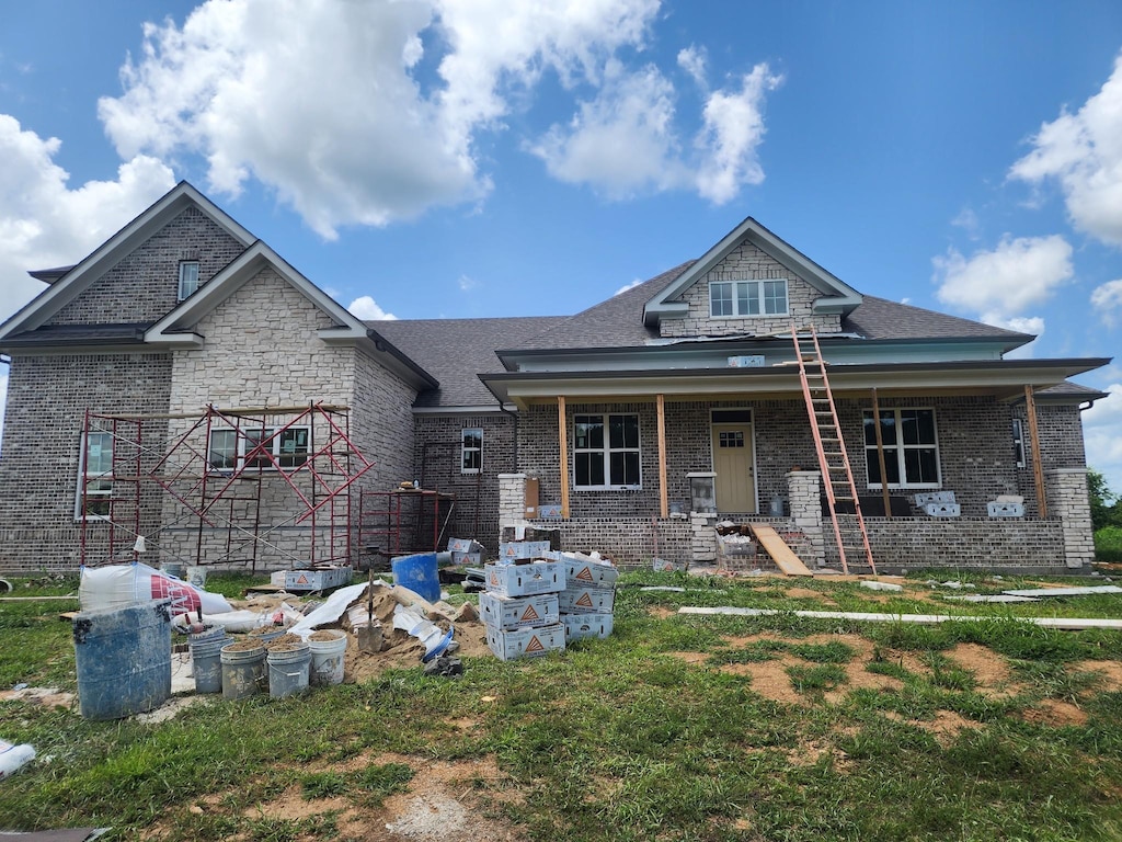 1597 John Sharp Rd, Spring Hill, TN 37174 - view of front of property featuring brick siding, a porch, and roof with shingles