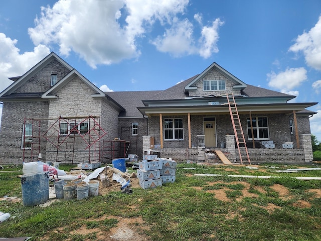 1597 John Sharp Rd, Spring Hill, TN 37174 - view of front of property featuring brick siding, a porch, and roof with shingles