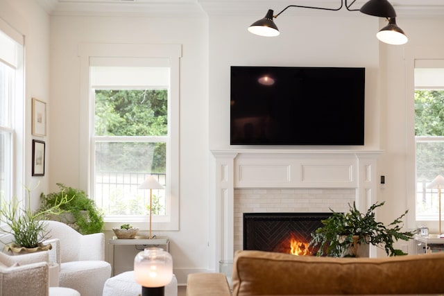 7019 Bolton St, Franklin, TN 37064 - living area with healthy amount of natural light, crown molding, and a fireplace