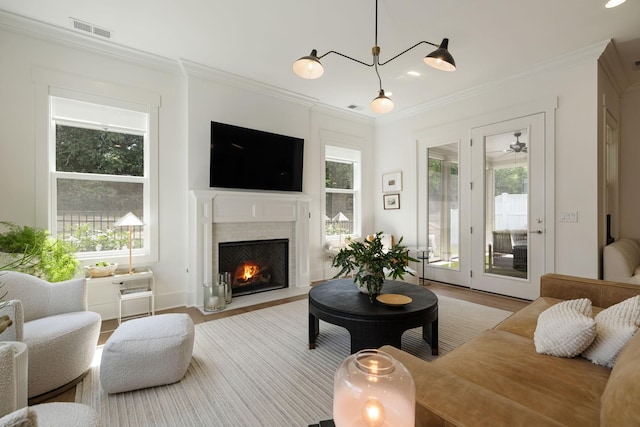 7019 Bolton St, Franklin, TN 37064 - living area with wood finished floors, crown molding, and a fireplace with flush hearth