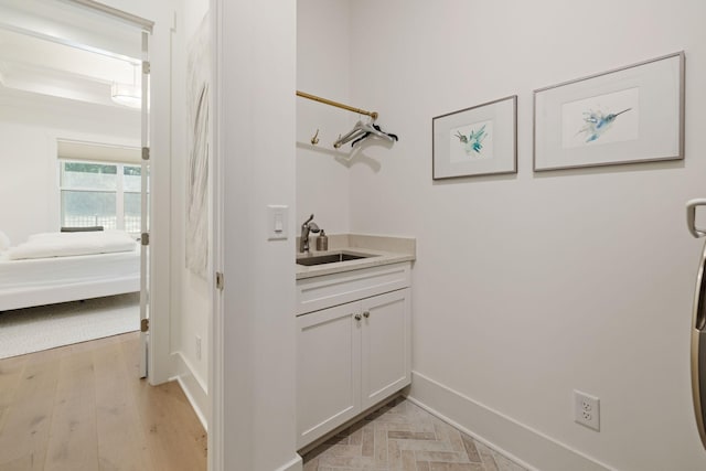7019 Bolton St, Franklin, TN 37064 - washroom featuring baseboards and light wood-type flooring