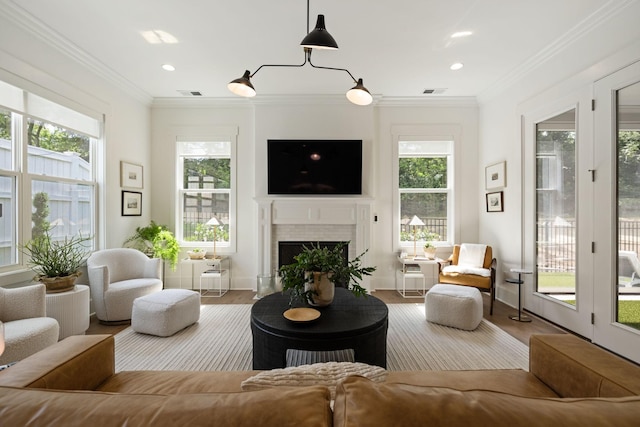 7019 Bolton St, Franklin, TN 37064 - living area with a fireplace, wood finished floors, ornamental molding, and recessed lighting
