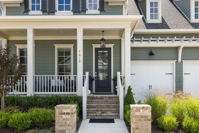 7019 Bolton St, Franklin, TN 37064 - doorway to property with a shingled roof and covered porch
