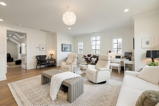 7019 Bolton St, Franklin, TN 37064 - living room featuring light wood finished floors, ornamental molding, and recessed lighting