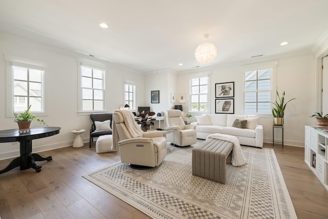 7019 Bolton St, Franklin, TN 37064 - living room with crown molding, hardwood / wood-style floors, recessed lighting, and a chandelier
