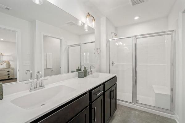 2202 Melk Ln, Columbia, TN 38401 - bathroom featuring double vanity, tile patterned flooring, a stall shower, and recessed lighting
