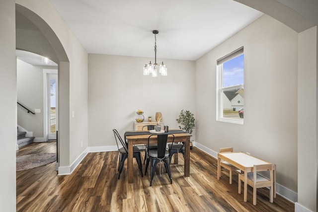 2015 Morgan Ct, Springfield, TN 37172 - dining room with dark wood finished floors, arched walkways, stairway, and a chandelier