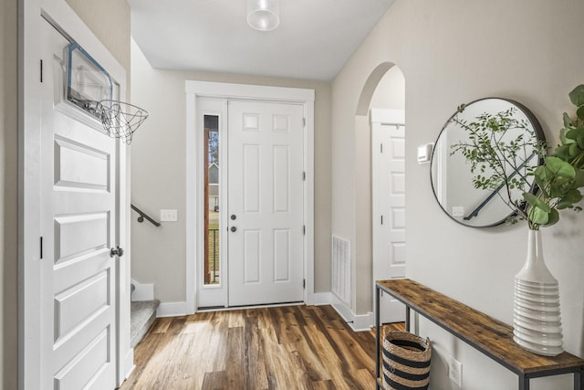 2015 Morgan Ct, Springfield, TN 37172 - entrance foyer with dark wood finished floors, arched walkways, and stairs