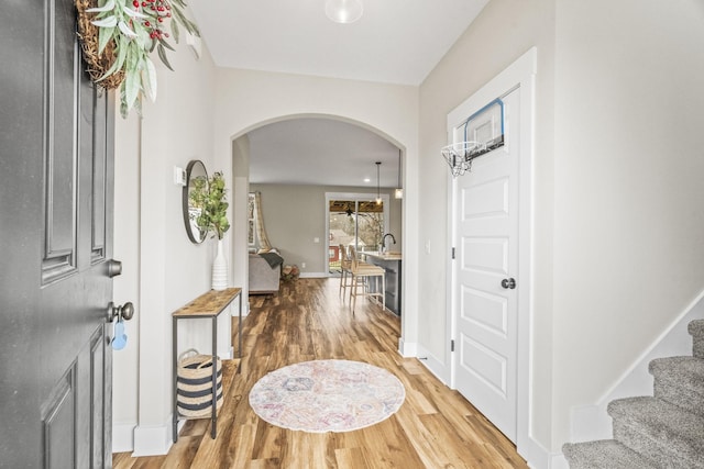2015 Morgan Ct, Springfield, TN 37172 - foyer entrance with arched walkways, wood finished floors, and stairway