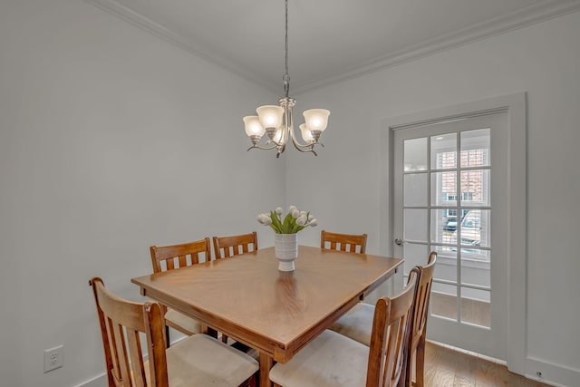 4029 Viola Ln, Franklin, TN 37069 - dining area with crown molding, a chandelier, and light wood-style floors