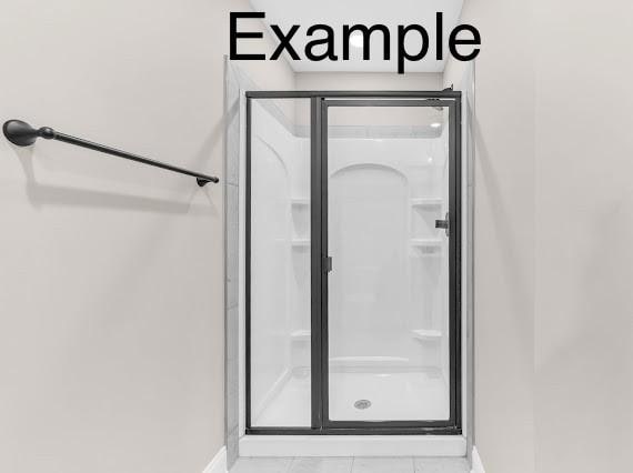 153 Irish Hls, Clarksville, TN 37042 - bathroom featuring a stall shower and baseboards