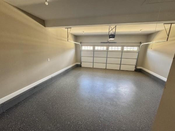 153 Irish Hls, Clarksville, TN 37042 - garage with a garage door opener and baseboards
