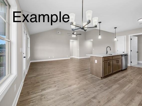 153 Irish Hls, Clarksville, TN 37042 - kitchen with stainless steel dishwasher, decorative light fixtures, light countertops, light wood-style floors, and vaulted ceiling