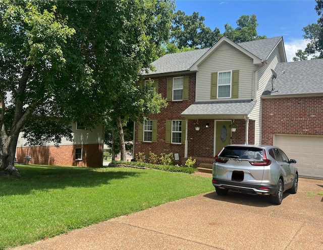 2532 Edinburgh St, Old Hickory, TN 37138 - traditional-style house featuring driveway, roof with shingles, a front yard, and brick siding
