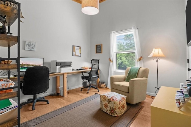 2006 Goodrich Rd, Nunnelly, TN 37137 - home office with light wood-style flooring and a high ceiling