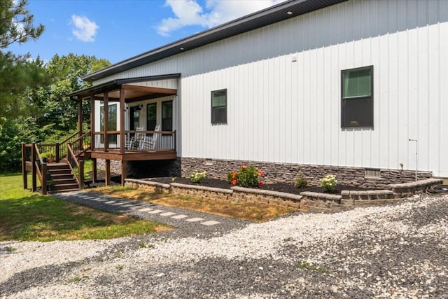 2006 Goodrich Rd, Nunnelly, TN 37137 - view of side of property featuring stairs, a deck, a sunroom, and crawl space