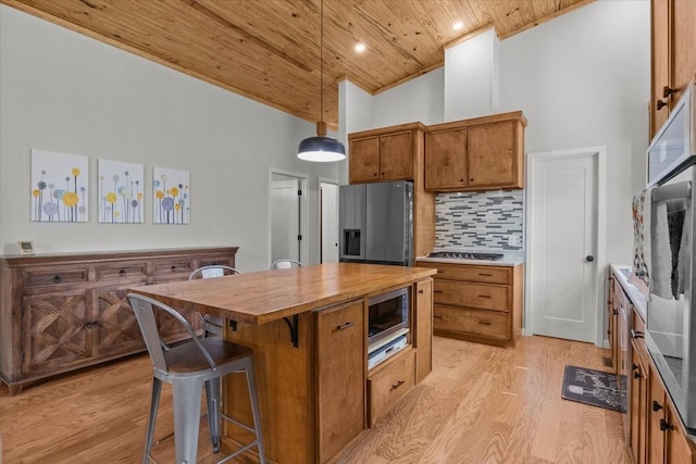 2006 Goodrich Rd, Nunnelly, TN 37137 - kitchen with wooden ceiling, high vaulted ceiling, butcher block countertops, stainless steel appliances, and light wood finished floors