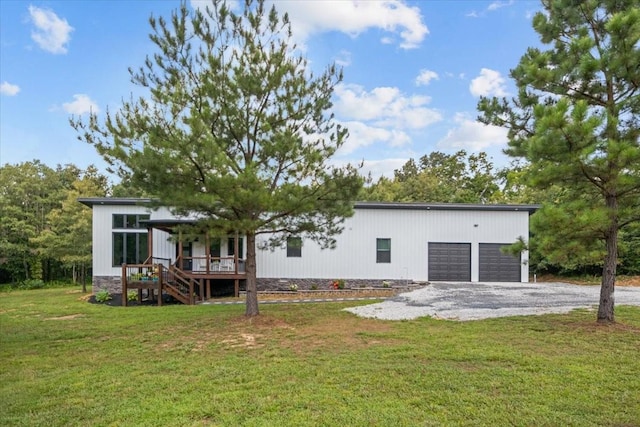 2006 Goodrich Rd, Nunnelly, TN 37137 - back of house with stairs, a lawn, driveway, and a deck