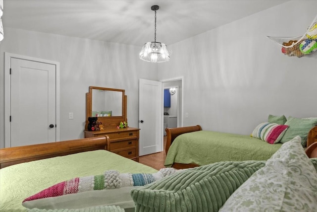 2006 Goodrich Rd, Nunnelly, TN 37137 - bedroom featuring wood finished floors and a chandelier